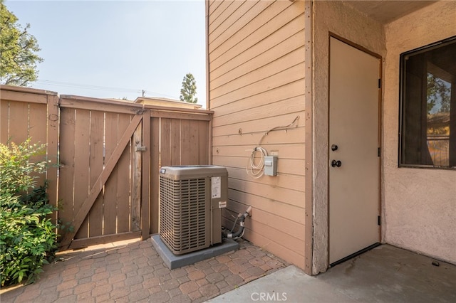 1303 Massachusetts Ave Unit 101, Riverside, CA 92507 - view of property exterior featuring a gate and cooling unit
