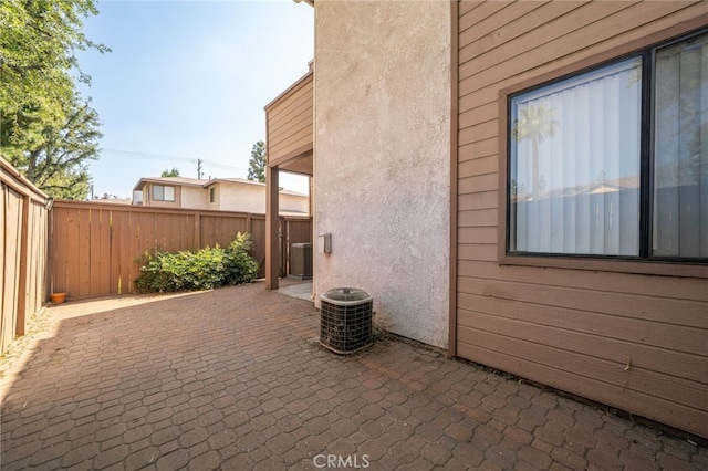 exterior space with a fenced backyard and central air condition unit
