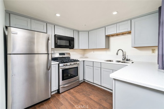 1303 Massachusetts Ave Unit 101, Riverside, CA 92507 - kitchen with appliances with stainless steel finishes, a sink, light countertops, recessed lighting, and dark wood-style floors