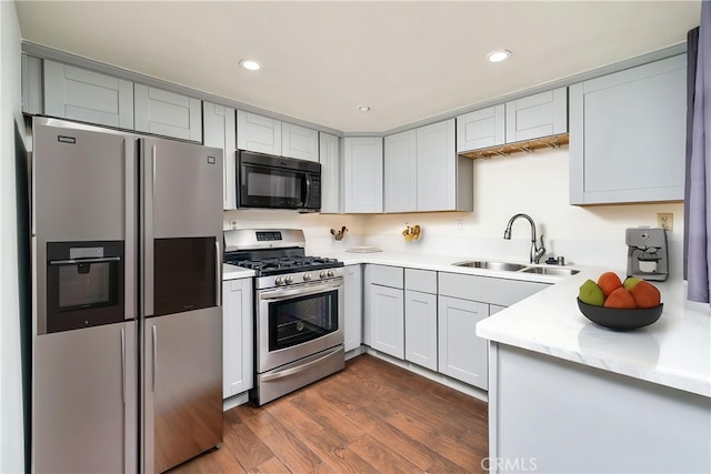 1303 Massachusetts Ave Unit 101, Riverside, CA 92507 - kitchen with stainless steel appliances, a sink, dark wood-style flooring, and recessed lighting