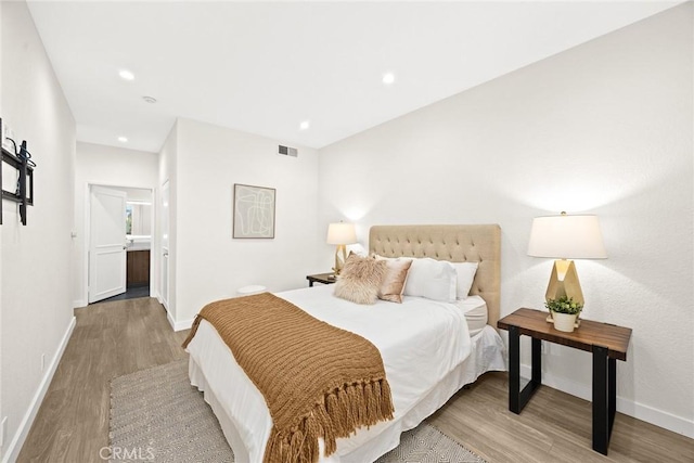 1310 N Detroit St Unit 405, Los Angeles, CA 90046 - bedroom featuring visible vents, recessed lighting, baseboards, and wood finished floors