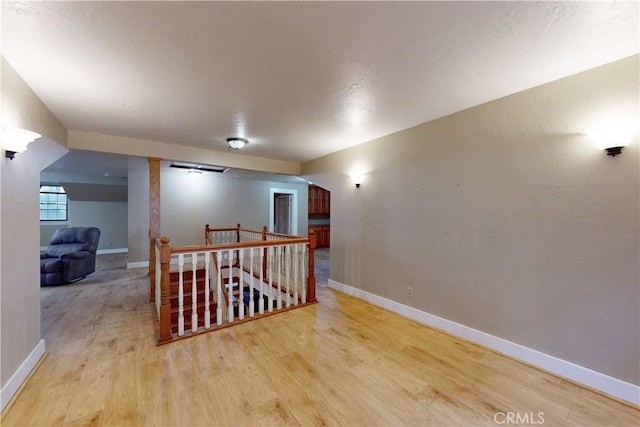 1473 Willow Rd, Nipomo, CA 93444 - corridor featuring an upstairs landing and wood finished floors