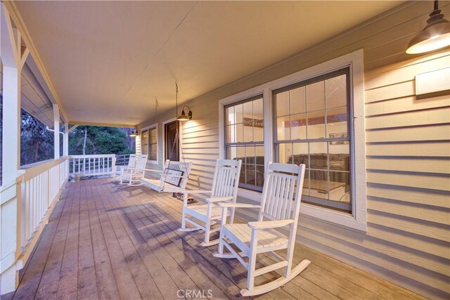 wooden terrace with covered porch