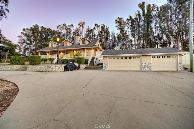 1473 Willow Rd, Nipomo, CA 93444 - view of front of home featuring a garage, a porch, driveway, and stairway