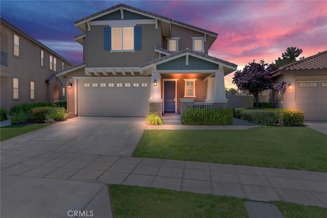 26121 Citron St, Loma Linda, CA 92354 - craftsman-style house with a lawn, an attached garage, concrete driveway, and a porch