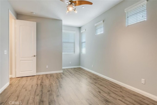 26121 Citron St, Loma Linda, CA 92354 - unfurnished room with baseboards, a ceiling fan, and wood finished floors