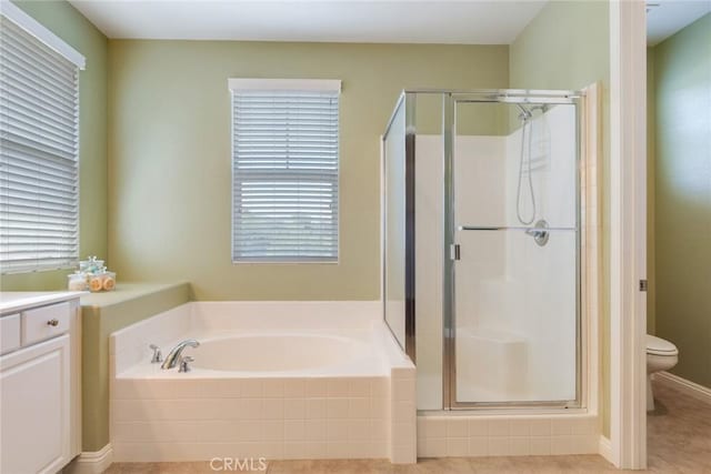 26121 Citron St, Loma Linda, CA 92354 - bathroom with vanity, a stall shower, a bath, and toilet