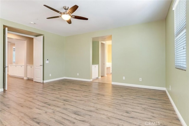 26121 Citron St, Loma Linda, CA 92354 - unfurnished room with baseboards, light wood-style flooring, and ceiling fan