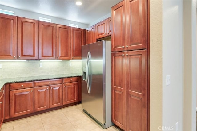 26121 Citron St, Loma Linda, CA 92354 - kitchen with stainless steel fridge, recessed lighting, stone counters, light tile patterned floors, and tasteful backsplash