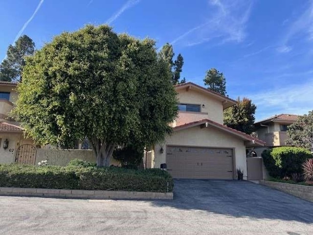61 Paseo Esplendido, Camarillo, CA 93010 - obstructed view of property with concrete driveway, an attached garage, and stucco siding