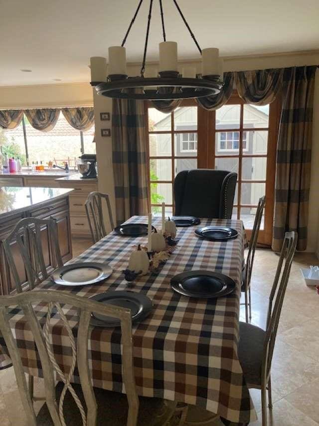 61 Paseo Esplendido, Camarillo, CA 93010 - dining room with a healthy amount of sunlight, light tile patterned floors, and a notable chandelier