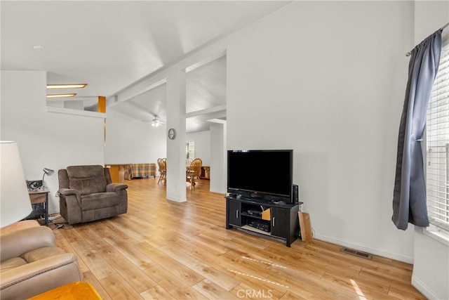 27828 Spyglass Ln, Canyon Country, CA 91351 - living room featuring a ceiling fan, visible vents, vaulted ceiling with beams, and light wood-style flooring