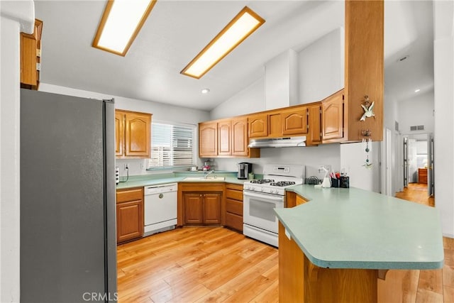 27828 Spyglass Ln, Canyon Country, CA 91351 - kitchen featuring a peninsula, white appliances, high vaulted ceiling, under cabinet range hood, and light wood-style flooring