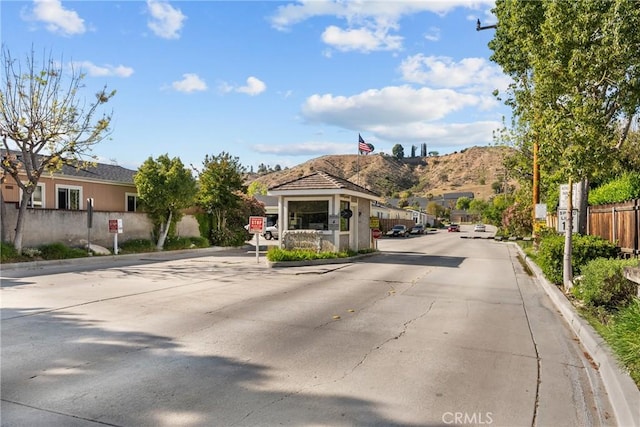 27828 Spyglass Ln, Canyon Country, CA 91351 - view of road with a mountain view, traffic signs, and curbs