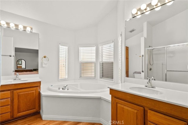 27828 Spyglass Ln, Canyon Country, CA 91351 - full bath featuring a sink, a stall shower, wood finished floors, and visible vents
