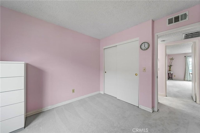 119 N Alhambra Ave Unit D, Monterey Park, CA 91755 - unfurnished bedroom with carpet floors, a textured ceiling, and a closet