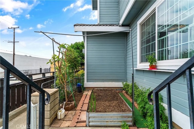 view of side of property with a vegetable garden