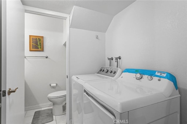 washroom with laundry area, baseboards, independent washer and dryer, and tile patterned floors