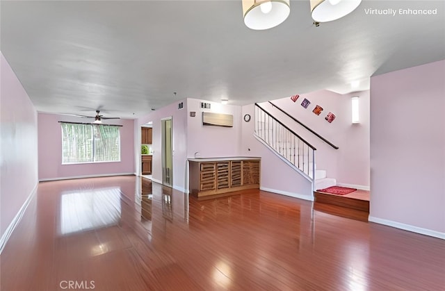 119 N Alhambra Ave Unit D, Monterey Park, CA 91755 - unfurnished living room with wood finished floors, stairs, and a ceiling fan