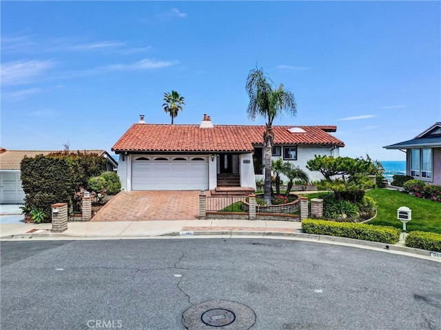 30062 Grandpoint Ln, Rancho Palos Verdes, CA 90275 - view of front of house featuring a tiled roof, an attached garage, decorative driveway, stucco siding, and a chimney