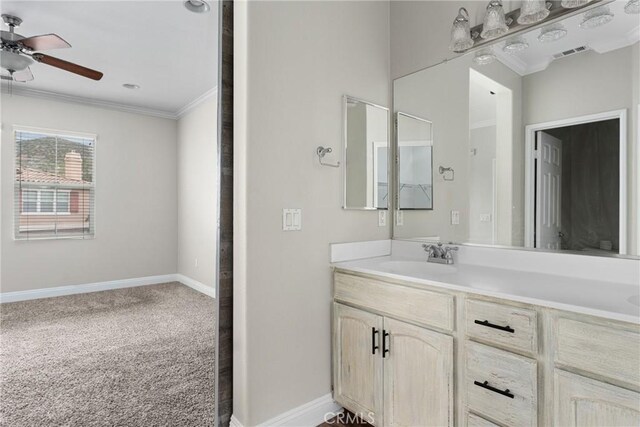 15427 Park Point Ave Unit 110, Lake Elsinore, CA 92532 - bathroom featuring crown molding, a ceiling fan, vanity, and baseboards