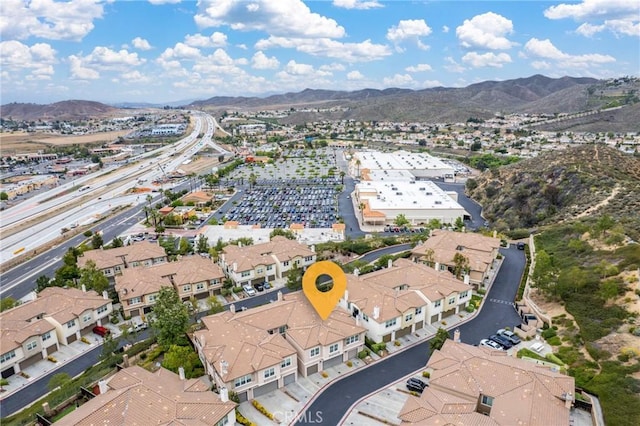 15427 Park Point Ave Unit 110, Lake Elsinore, CA 92532 - aerial overview of property's location featuring a mountain backdrop and nearby suburban area