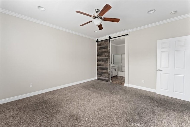 15427 Park Point Ave Unit 110, Lake Elsinore, CA 92532 - unfurnished bedroom with carpet floors, a barn door, ornamental molding, baseboards, and connected bathroom