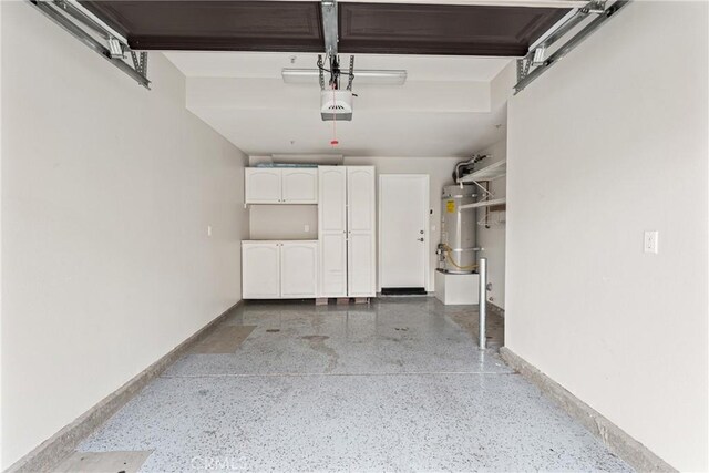 15427 Park Point Ave Unit 110, Lake Elsinore, CA 92532 - garage with secured water heater, baseboards, and a garage door opener
