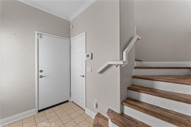 15427 Park Point Ave Unit 110, Lake Elsinore, CA 92532 - foyer featuring ornamental molding, stairs, light tile patterned floors, and baseboards