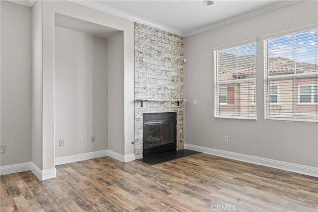 15427 Park Point Ave Unit 110, Lake Elsinore, CA 92532 - unfurnished living room with wood finished floors, a fireplace, ornamental molding, and baseboards