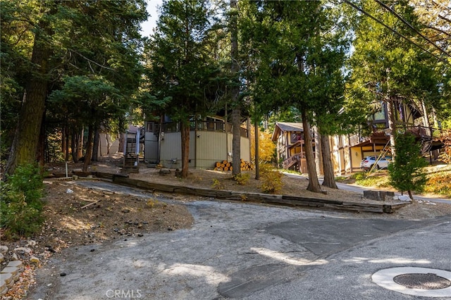 view of front of property featuring stairway
