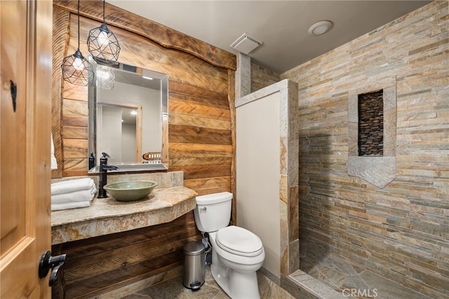 bathroom with vanity, walk in shower, visible vents, and toilet