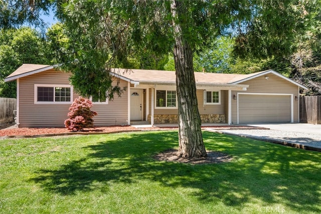 9137 Midway, Durham, CA 95938 - ranch-style home featuring a garage, fence, concrete driveway, and a front yard