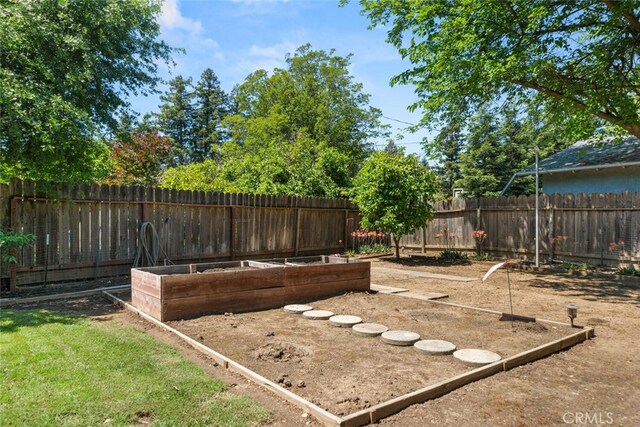 9137 Midway, Durham, CA 95938 - view of yard featuring a fenced backyard and a garden
