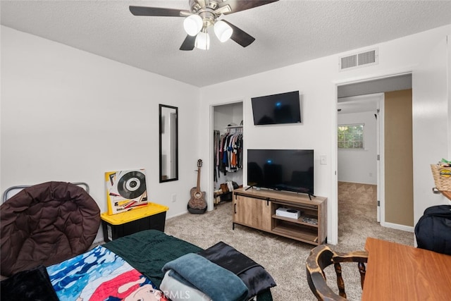 9137 Midway, Durham, CA 95938 - carpeted living room with ceiling fan, a textured ceiling, and visible vents