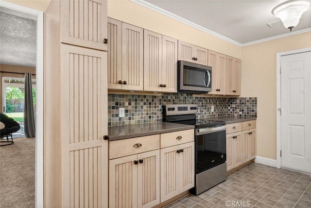 9137 Midway, Durham, CA 95938 - kitchen with visible vents, dark countertops, appliances with stainless steel finishes, tasteful backsplash, and ornamental molding
