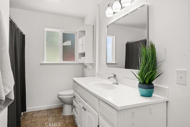 9137 Midway, Durham, CA 95938 - bathroom featuring toilet, baseboards, and vanity