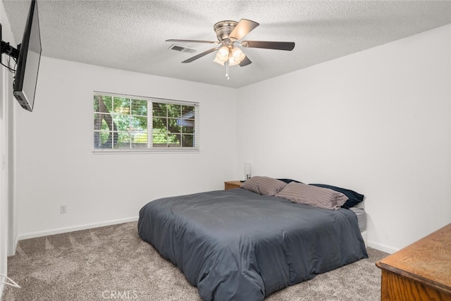 9137 Midway, Durham, CA 95938 - carpeted bedroom featuring ceiling fan, a textured ceiling, visible vents, and baseboards