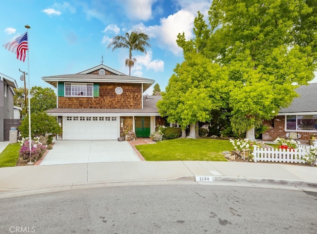 view of front facade featuring a garage, fence, a front lawn, concrete driveway, and a shingled roof