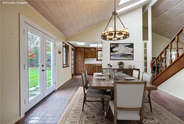 dining room with baseboards, a notable chandelier, and a wealth of natural light