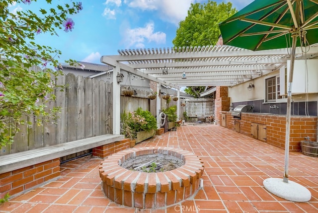 view of patio / terrace featuring a fenced backyard, a pergola, and area for grilling