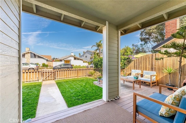 view of patio / terrace with a fenced backyard, outdoor lounge area, a residential view, and a deck