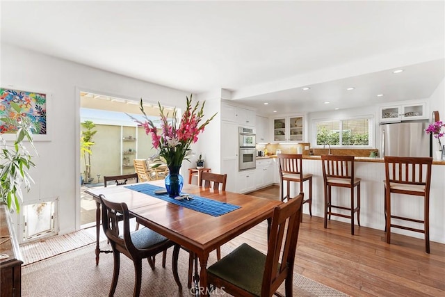 dining room featuring light wood-style floors and recessed lighting