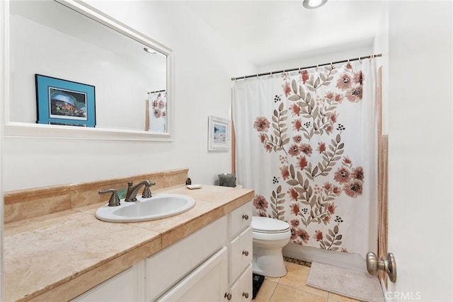 bathroom with tile patterned flooring, curtained shower, toilet, and vanity
