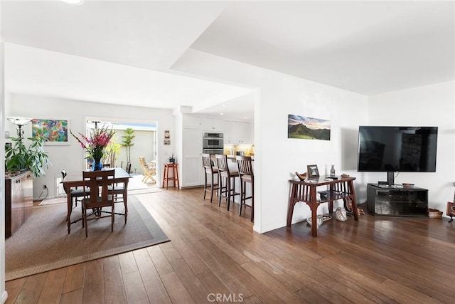 dining area with recessed lighting and dark wood-style floors