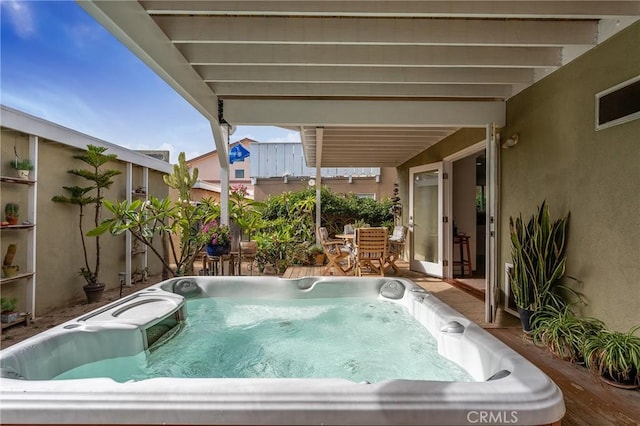 exterior space featuring a hot tub