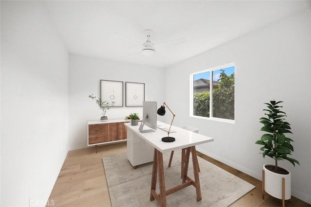 home office with ceiling fan and light wood-style floors