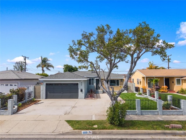 ranch-style home featuring a garage, a fenced front yard, driveway, and stucco siding
