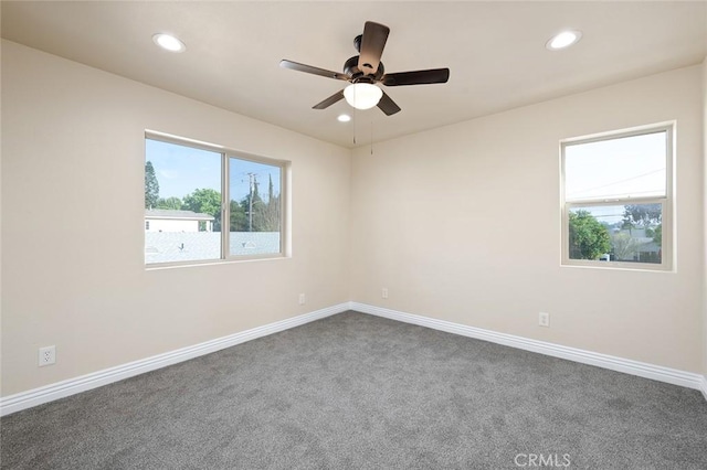 1920 C St, La Verne, CA 91750 - empty room with recessed lighting, dark carpet, and a wealth of natural light