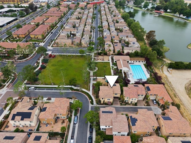 birds eye view of property featuring a water view and a residential view